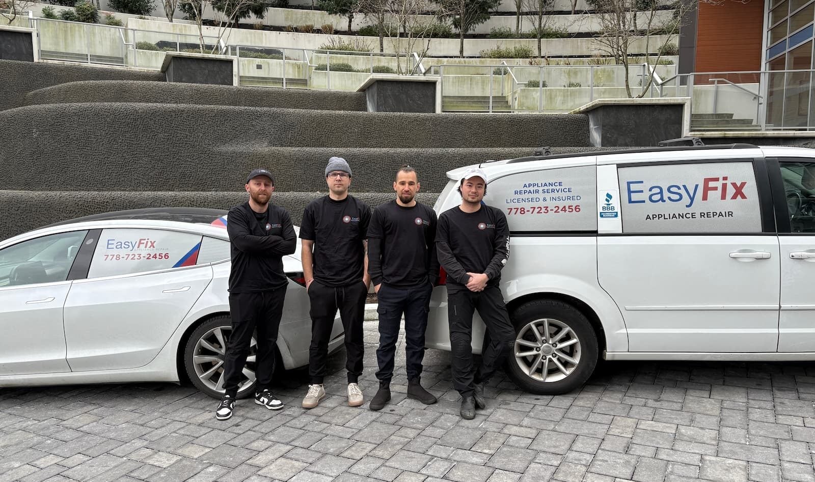 EasyFix Appliance Repair Vancouver owners and technicians with branded service vehicles.